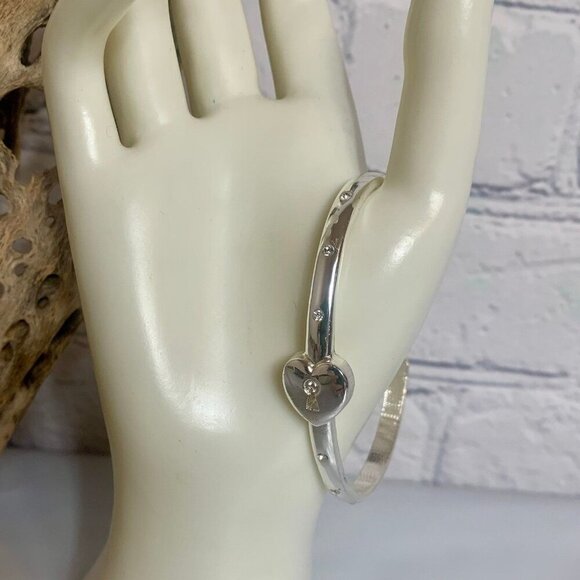 AVON NRQ You Hold the Key Silver-Tone Cuff Bracelet - Picture 1 of 6